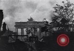Image of Soviet soldier with  PPSh sub machine gun pulls German soldier from cellar Berlin Germany, 1945, second 31 stock footage video 65675074103