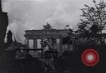 Image of Soviet soldier with  PPSh sub machine gun pulls German soldier from cellar Berlin Germany, 1945, second 33 stock footage video 65675074103
