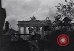 Image of Soviet soldier with  PPSh sub machine gun pulls German soldier from cellar Berlin Germany, 1945, second 34 stock footage video 65675074103