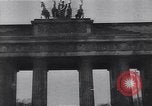 Image of Soviet soldier with  PPSh sub machine gun pulls German soldier from cellar Berlin Germany, 1945, second 35 stock footage video 65675074103