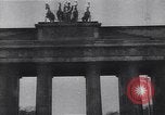 Image of Soviet soldier with  PPSh sub machine gun pulls German soldier from cellar Berlin Germany, 1945, second 36 stock footage video 65675074103