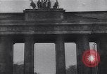 Image of Soviet soldier with  PPSh sub machine gun pulls German soldier from cellar Berlin Germany, 1945, second 37 stock footage video 65675074103