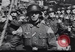 Image of Soviet soldier with  PPSh sub machine gun pulls German soldier from cellar Berlin Germany, 1945, second 48 stock footage video 65675074103