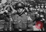 Image of Soviet soldier with  PPSh sub machine gun pulls German soldier from cellar Berlin Germany, 1945, second 49 stock footage video 65675074103