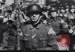 Image of Soviet soldier with  PPSh sub machine gun pulls German soldier from cellar Berlin Germany, 1945, second 50 stock footage video 65675074103