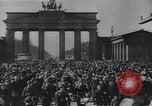 Image of Soviet soldier with  PPSh sub machine gun pulls German soldier from cellar Berlin Germany, 1945, second 52 stock footage video 65675074103