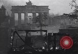 Image of Soviet soldier with  PPSh sub machine gun pulls German soldier from cellar Berlin Germany, 1945, second 58 stock footage video 65675074103