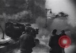 Image of Soviet soldier with  PPSh sub machine gun pulls German soldier from cellar Berlin Germany, 1945, second 59 stock footage video 65675074103