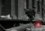 Image of U.S. Army patrol moves carefully through ruins of German City Ludwigshafen Germany, 1945, second 8 stock footage video 65675074328