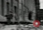 Image of U.S. Army patrol moves carefully through ruins of German City Ludwigshafen Germany, 1945, second 11 stock footage video 65675074328