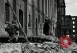 Image of U.S. Army patrol moves carefully through ruins of German City Ludwigshafen Germany, 1945, second 12 stock footage video 65675074328