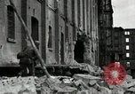 Image of U.S. Army patrol moves carefully through ruins of German City Ludwigshafen Germany, 1945, second 13 stock footage video 65675074328