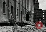 Image of U.S. Army patrol moves carefully through ruins of German City Ludwigshafen Germany, 1945, second 14 stock footage video 65675074328