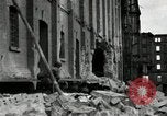 Image of U.S. Army patrol moves carefully through ruins of German City Ludwigshafen Germany, 1945, second 15 stock footage video 65675074328