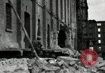 Image of U.S. Army patrol moves carefully through ruins of German City Ludwigshafen Germany, 1945, second 16 stock footage video 65675074328