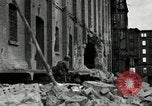 Image of U.S. Army patrol moves carefully through ruins of German City Ludwigshafen Germany, 1945, second 17 stock footage video 65675074328