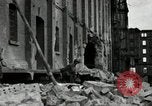 Image of U.S. Army patrol moves carefully through ruins of German City Ludwigshafen Germany, 1945, second 18 stock footage video 65675074328
