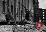 Image of U.S. Army patrol moves carefully through ruins of German City Ludwigshafen Germany, 1945, second 20 stock footage video 65675074328