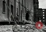 Image of U.S. Army patrol moves carefully through ruins of German City Ludwigshafen Germany, 1945, second 21 stock footage video 65675074328