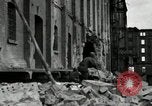 Image of U.S. Army patrol moves carefully through ruins of German City Ludwigshafen Germany, 1945, second 22 stock footage video 65675074328