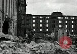 Image of U.S. Army patrol moves carefully through ruins of German City Ludwigshafen Germany, 1945, second 23 stock footage video 65675074328