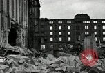 Image of U.S. Army patrol moves carefully through ruins of German City Ludwigshafen Germany, 1945, second 24 stock footage video 65675074328