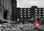 Image of U.S. Army patrol moves carefully through ruins of German City Ludwigshafen Germany, 1945, second 25 stock footage video 65675074328