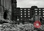 Image of U.S. Army patrol moves carefully through ruins of German City Ludwigshafen Germany, 1945, second 26 stock footage video 65675074328