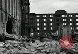 Image of U.S. Army patrol moves carefully through ruins of German City Ludwigshafen Germany, 1945, second 27 stock footage video 65675074328