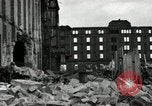Image of U.S. Army patrol moves carefully through ruins of German City Ludwigshafen Germany, 1945, second 28 stock footage video 65675074328