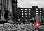 Image of U.S. Army patrol moves carefully through ruins of German City Ludwigshafen Germany, 1945, second 30 stock footage video 65675074328