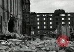 Image of U.S. Army patrol moves carefully through ruins of German City Ludwigshafen Germany, 1945, second 32 stock footage video 65675074328