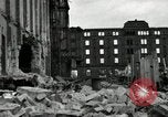 Image of U.S. Army patrol moves carefully through ruins of German City Ludwigshafen Germany, 1945, second 35 stock footage video 65675074328