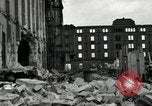 Image of U.S. Army patrol moves carefully through ruins of German City Ludwigshafen Germany, 1945, second 36 stock footage video 65675074328