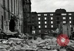Image of U.S. Army patrol moves carefully through ruins of German City Ludwigshafen Germany, 1945, second 37 stock footage video 65675074328
