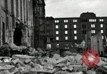Image of U.S. Army patrol moves carefully through ruins of German City Ludwigshafen Germany, 1945, second 38 stock footage video 65675074328