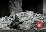 Image of U.S. Army patrol moves carefully through ruins of German City Ludwigshafen Germany, 1945, second 40 stock footage video 65675074328