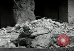 Image of U.S. Army patrol moves carefully through ruins of German City Ludwigshafen Germany, 1945, second 41 stock footage video 65675074328