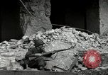 Image of U.S. Army patrol moves carefully through ruins of German City Ludwigshafen Germany, 1945, second 42 stock footage video 65675074328