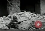 Image of U.S. Army patrol moves carefully through ruins of German City Ludwigshafen Germany, 1945, second 43 stock footage video 65675074328