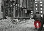 Image of U.S. Army patrol moves carefully through ruins of German City Ludwigshafen Germany, 1945, second 45 stock footage video 65675074328