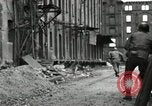 Image of U.S. Army patrol moves carefully through ruins of German City Ludwigshafen Germany, 1945, second 46 stock footage video 65675074328