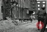 Image of U.S. Army patrol moves carefully through ruins of German City Ludwigshafen Germany, 1945, second 47 stock footage video 65675074328