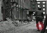 Image of U.S. Army patrol moves carefully through ruins of German City Ludwigshafen Germany, 1945, second 48 stock footage video 65675074328