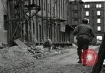 Image of U.S. Army patrol moves carefully through ruins of German City Ludwigshafen Germany, 1945, second 49 stock footage video 65675074328