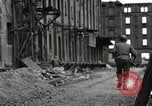 Image of U.S. Army patrol moves carefully through ruins of German City Ludwigshafen Germany, 1945, second 50 stock footage video 65675074328