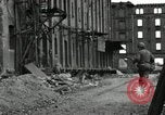 Image of U.S. Army patrol moves carefully through ruins of German City Ludwigshafen Germany, 1945, second 51 stock footage video 65675074328