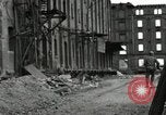 Image of U.S. Army patrol moves carefully through ruins of German City Ludwigshafen Germany, 1945, second 53 stock footage video 65675074328