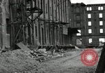 Image of U.S. Army patrol moves carefully through ruins of German City Ludwigshafen Germany, 1945, second 56 stock footage video 65675074328