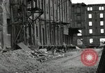 Image of U.S. Army patrol moves carefully through ruins of German City Ludwigshafen Germany, 1945, second 57 stock footage video 65675074328